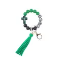 Detailed view of green silicone beaded wristlet keychain with cross charm and tassel. - Leopard Print Green