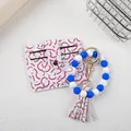 Detail of baseball pattern leather cardholder with blue and white silicone bead keychain - Dark Blue White
