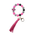 Close-up detail of silicone beaded keychain with medical cross charm and pink tassel - Cross Rose Red