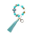 Close-up view of silicone beaded keychain with teal tassel and leopard print beads - Cross Lake Blue