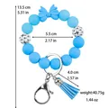 Blauwe siliconen kralen armband sleutelhanger met strikje en PU kwastje versiering - Blauw (lichtgevend)