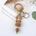 Cartoon highland cow keychain featuring brown fur pompom and silicone beads variant - Hat Style / Gray