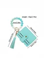 Light blue PU leather card holder with silicone beaded wristlet and matching tassel - Emerald
