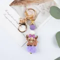 Cartoon cow silicone bead keychain with purple pompom and gold lobster clasp - Bowknot Style / Purple