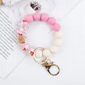 Handmade silicone beaded wristlet keychain with floral print beads and gold clasp - Pink