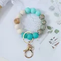 Teal and cream silicone beaded wristlet keychain with floral pattern and gold clasp - Mint Green
