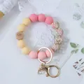 Floral silicone bead wristlet keychain with pink and yellow matte beads and gold clasp - Yellow