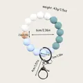Teal and light blue silicone beaded keychain with wood bead and lobster clasp detail - Blue