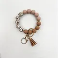 Stylish leopard print silicone bead bracelet keychain with brown tassel and gold clasp - Cow Print