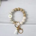 Beige and tan silicone bead wristlet keychain with white daisy charm and tassel - White