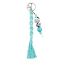 Handmade light blue macrame cow keychain with silicone beads and a decorative tassel - Mint Blue
