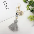 Nordischer Boho Quasten-Schlüsselanhänger mit Perlen und Teach Love Inspire Holzscheibe. - Grau (K-1014)