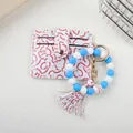 Top-down view of baseball pattern card holder with blue and white silicone bead keychain - Light Blue/White
