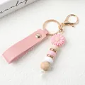 Personalisierter rosa Gänseblümchen Schlüsselanhänger mit Silikonperlen und Leder-Handschlaufe. - Rosa