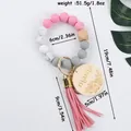 Handmade silicone beaded keychain bracelet with engraved mama wood tag and pink tassel - Pink