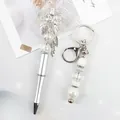 Stylish silver beaded ballpoint pen with crystal bow and matching keychain set - Ballpoint Pen / White