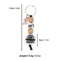 Handmade religious keychain featuring wooden beads and 'With God' silicone disc charm - Heart Print / Pink