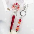 Handmade red beaded ballpoint pen and keychain set with elegant crystal bow charm - Ballpoint Pen / Red