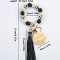 Handmade silicone bead wristlet keychain with cow print beads, leather tassel and 'Mama' charm - Black