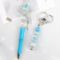 Blue beaded ballpoint pen and matching keychain set featuring a bow and rhinestones - Blue