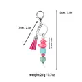 Detailed measurements and weight of the colorful silicone bead duck keychain. - Pink