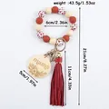 Silicone bead keychain wristlet with cow print beads, red tassel and mama wood disc. - Burgundy