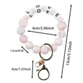 Rosa Silikonperlen-Armband-Schlüsselanhänger mit LOVE-Buchstaben und glitzernden Perlen - LOVE-Buchstaben-Stil / Perlmutt-Rosa