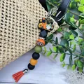 Halloween μπρελόκ με χάντρες, γκνομ κολοκύθα και πορτοκαλί φούντα για την τσάντα - Ηλίανθος (K-1415)