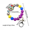 Colorful silicone beaded wristlet keychain with book charm and leopard print beads - Purple