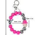 Süßer pinker Silikon-Perlen-Schlüsselanhänger mit Kuh-Muster und Größenangaben - Smiley-Stil / Fuchsia