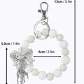 Silikon-Perlen-Schlüsselanhänger-Armband mit elegantem Kristall-Bogen und Maßen - Schleifenstil / Weiß