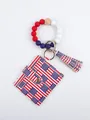 Detail view of silicone bead wristlet keychain with US flag pattern card holder and tassel - Star and Stripes Flag Style