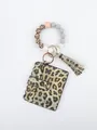 Detail of leopard print card holder with silicone beaded wristlet and tassel pendant. - Light Leopard Style