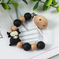 Sujetachupetes para bebé con cuentas de madera y charm de vaca escocesa de silicona. - Estilo Vaca de las Tierras Altas (K-2143) / Negro