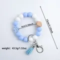 Blue and white silicone beaded keychain bracelet with tassel, wood bead and measurements - Sky Blue