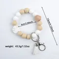 Silicone beaded wristlet keychain with tassel and wooden bead in white and tan - Off White