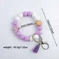 Handmade purple and white silicone beaded wristlet keychain with tassel and wood bead - Violet