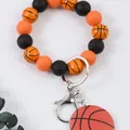Llavero de pulsera con cuentas de baloncesto deportivo y cuentas de silicona naranjas - Baloncesto / Naranja
