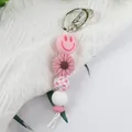 Llavero de cuentas de silicona rosa con cara sonriente y colgante de flor para bolsos mujer - Estilo Colgante (K-1567) / Rosa