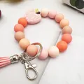 Handmade pink silicone beaded wristlet keychain with peach tones and apple charm - Light Pink