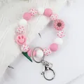 Rosa Silikon-Perlen-Schlüsselanhänger mit Schachbrettmuster, Smiley und Blume. - Armband Ring Stil (K-1567) / Rosa
