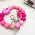 Pink silicone beaded keychain bracelet with apple charm and tassel - Rose Red
