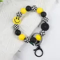 Trendiger Silikonperlen Schlüsselanhänger in Schwarz Gelb mit Smiley und Blumenanhänger - Armband Ring Stil (K-1567) / Gelb