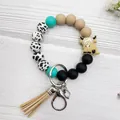 Handmade fashionable Highland cow silicone bead wristlet keychain with stylish tan tassel - Highland Cow-Black Cow Pattern