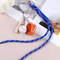 Portachiavi a corda blu intrecciata a mano con ciondoli da baseball per borse e zaini. - Blu