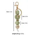 Porte-clés en perles de silicone vert sauge avec breloque tournesol et Blessed gravé - Style de Lettre Blessed / Vert