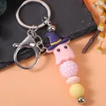 Adorable pink Halloween ghost keychain featuring a purple witch hat and colorful beads - Ghost Style Beaded Keychain (K-1418) / Pink