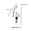Beaded silicone keychain featuring pearlized duck charm and tassel with dimensions - White
