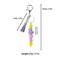 Colorful silicone bead keychain with purple tassel and metallic duck charm, 5.9 inch length - Purple