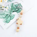 Cute silicone yellow duck keychain with trendy leopard print beads and silver metal ring - Off White